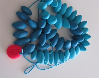 aqua blue, mid blue ombre pointy oval shape polymer necklace