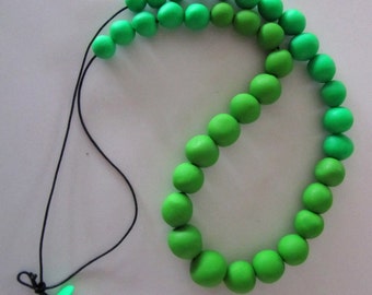 bright green and lighter bright green almost circular pebble polymer necklace