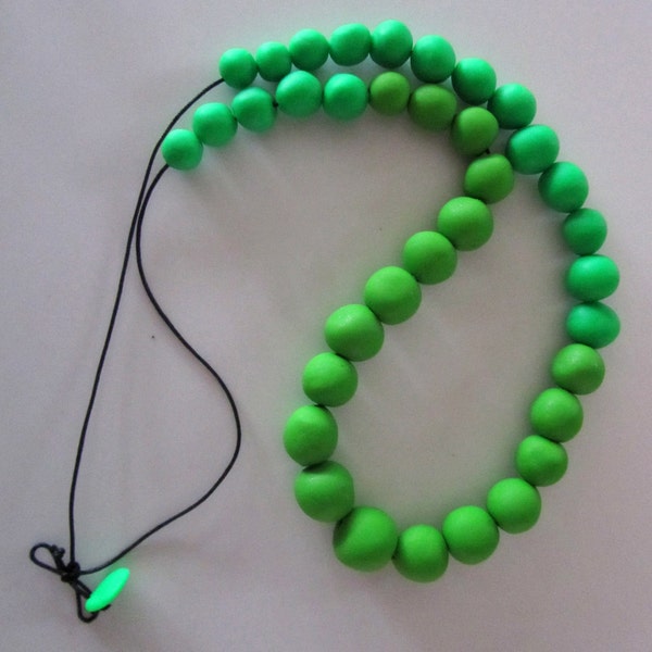 bright green and lighter bright green almost circular pebble polymer necklace