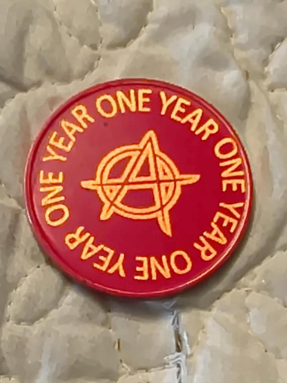 1 year sobriety coin made from a feau gold coin engraved.  I can paint them any color. I ship for exactly what it costs me.