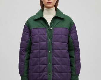 May include: A quilted jacket in a color block design. The jacket features a green collar and shoulder yoke, with a purple quilted body. The jacket has a button-up front and long sleeves. The model is wearing a white turtleneck underneath.