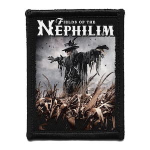 May include: Black rectangular patch with the text "Fields of the Nephilim" in white. The patch features a figure in a dark outfit with arms outstretched, standing in a field of tall grass. The patch has a black border.