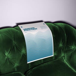 May include: A white poster with the title "WAVEFORM STRUCTURES" and blue wave pattern is displayed on a dark green velvet couch. The poster is a study on line, space, and motion. The couch has a tufted design.
