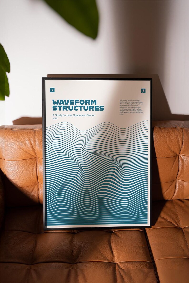 May include: A framed poster titled "Waveform Structures" with a teal and white wavy design. The poster includes the text "A Study on Line, Space and Motion 2025". The poster is displayed on a brown leather couch.