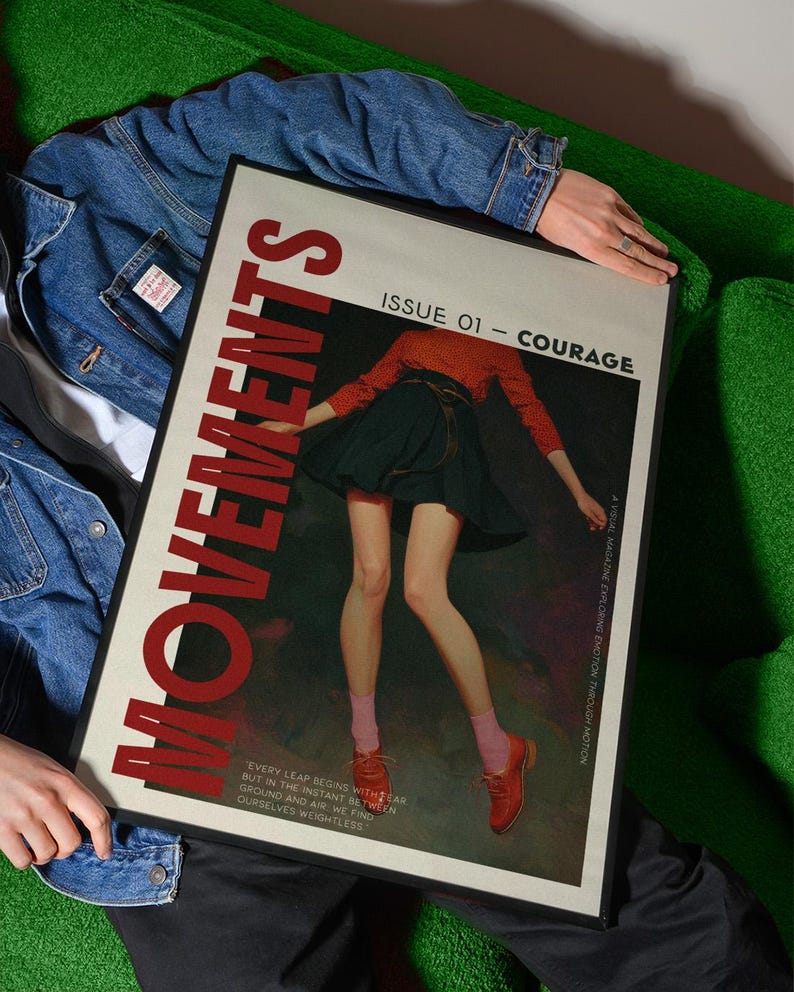 May include: A framed magazine cover with the word "MOVEMENTS" in large red letters. The cover features an illustration of a person in a red top and black skirt. The text "ISSUE 01 - COURAGE" is also visible.