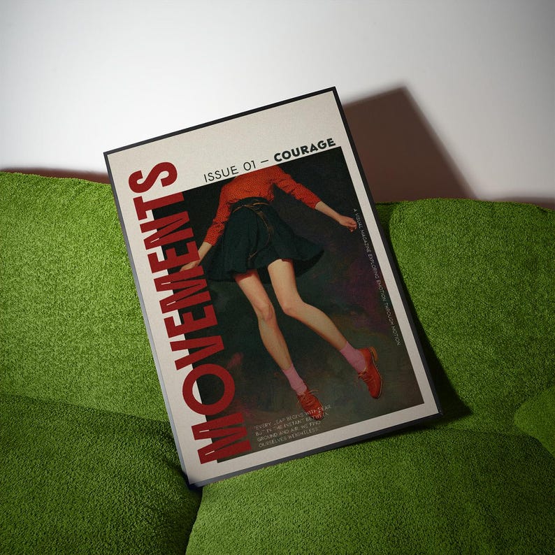 May include: A magazine titled "MOVEMENTS" with the text "ISSUE 01 - COURAGE" on a green couch. The cover features a person in a red top, black skirt, and red shoes. The magazine is angled towards the viewer.