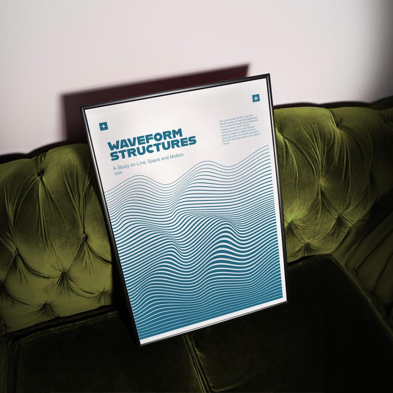 May include: A framed poster titled "Waveform Structures" with a black frame. The poster features a blue and white wavy design and the text "A Study on Line, Space and Motion". The poster is displayed on a green velvet couch.