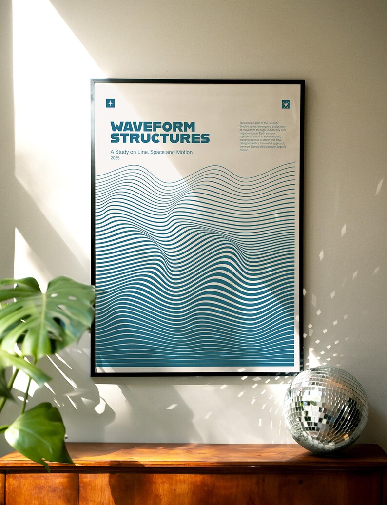 May include: A framed poster with the text "WAVEFORM STRUCTURES" and "A Study on Line, Space and Motion". The artwork features blue and white wavy lines. A disco ball and a potted plant are on a wooden surface below the poster.