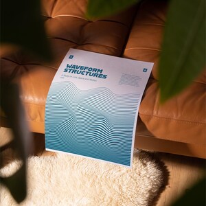 May include: A poster titled "WAVEFORM STRUCTURES" with a blue and white wave pattern design. The poster is on a brown leather couch, with a white fluffy rug in the foreground. Green leaves are in the upper right corner.