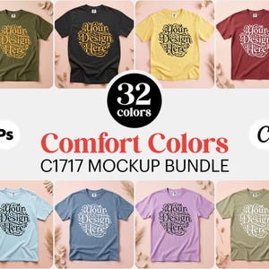 May include: A mockup bundle of t-shirts in various colors, including olive green, black, yellow, and burgundy. Each shirt features the text "Your Design Here" in a circular design. The image also displays the text "32 colors" and "Comfort Colors C1717 MOCKUP BUNDLE."