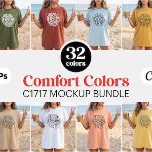 Peut inclure: Un ensemble de maquettes de t-shirts Comfort Colors C1717 de différentes couleurs, chacun avec le texte "Your Design Here". L'image affiche 32 options de couleurs, avec des modèles posant sur une plage. Le texte "Comfort Colors" est également visible.
