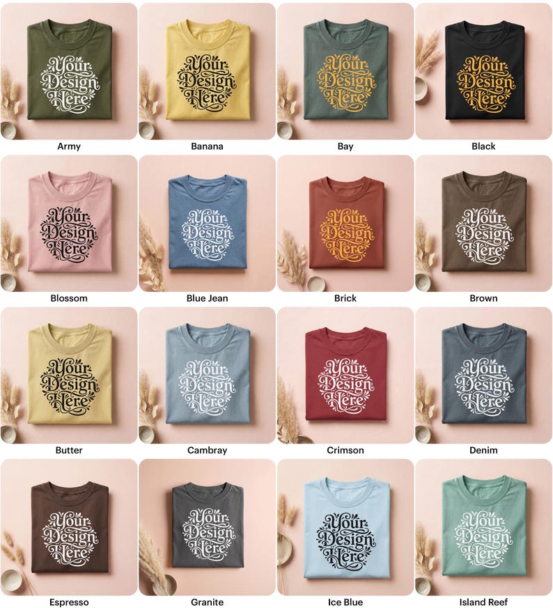 May include: A collection of folded t-shirts in various colors, each featuring the text "Your Design Here" in a circular design. Colors include army green, yellow, black, pink, blue, brown, and others.