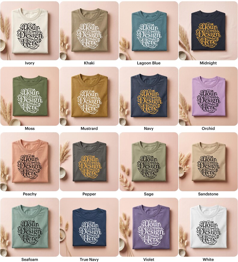 May include: A collection of folded t-shirts in various colors, including ivory, khaki, and lagoon blue. Each shirt features the text "Your Design Here" in a decorative font. The shirts are arranged on a neutral background with decorative elements.