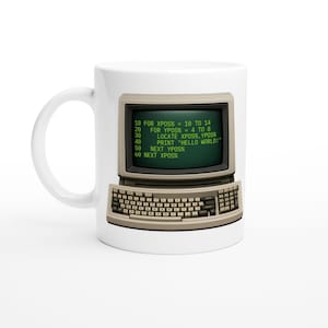 May include: White ceramic mug featuring a retro computer terminal design. The screen displays green text with the words "HELLO WORLD!". The mug has a curved handle and a beige keyboard.