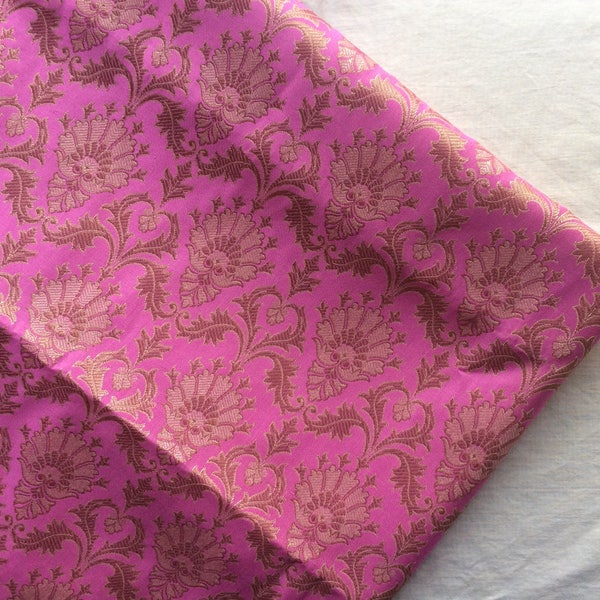 One yard of Indian brocade fabric in pink with dull gold in a regal pattern