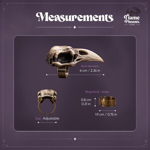 May include: An adjustable ring featuring a bird skull element measuring 2.36 inches in length. The ring band has a height of 0.31 inches and a diameter of 0.75 inches. The metal has a weathered bronze finish with dark recessed details.