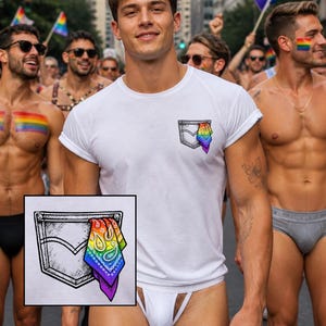 May include: White t-shirt with a pocket design featuring a rainbow-coloured bandana. The shirt is worn by a person in a crowd of people, some holding rainbow flags. The image is taken during a Pride parade.