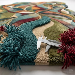 Close-up of hand tufted abstract rug showing thick texture and premium wool quality