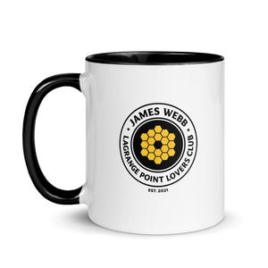 May include: White ceramic mug with a black handle and interior. The mug features a circular logo with the text "JAMES WEBB LAGRANGE POINT LOVERS CLUB EST. 2021" and a gold and black honeycomb design.