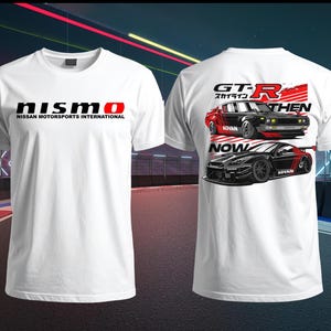 May include: White t-shirt featuring the NISMO logo in black and red on the front. The back of the shirt displays a graphic of two Nissan GT-R cars, one vintage and one modern, with the text "GT-R" and "NOW THEN".