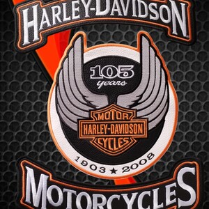 Biker patches in rocker style and classic winged logo 105 years to sew on the back of a jacket