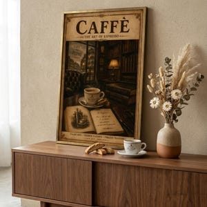May include: A framed print with the word "CAFFÈ" at the top, depicting a coffee shop scene with a cup of coffee on a table. The print is displayed on a wooden cabinet, next to a vase of dried flowers and a cup of coffee.