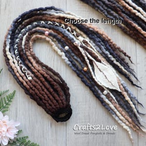 May include: A collection of wool dreadlocks in shades of brown, gray, and cream, some adorned with beads and a white felt leaf. The text "Choose the length" is visible. The logo "Crafts2Love" is also visible.