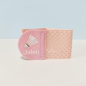 May include: A white ceramic mug with a black handle and the text "But First, Coffee" in a black, bold font. The mug is on a white surface. The mug is approximately 4 inches tall.