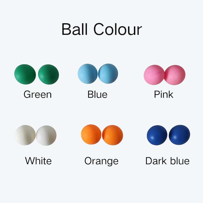 May include: A color chart titled Ball Colour displaying pairs of spherical balls in six distinct colors: green, blue, pink, white, orange, and dark blue. Each pair is labeled with its corresponding color name in black text below the items.