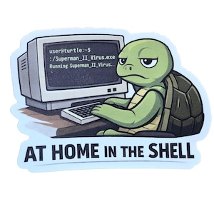 May include: A sticker featuring a green turtle with a computer, typing on a keyboard. The computer screen displays text, and the sticker reads "AT HOME IN THE SHELL".