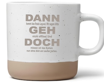 May include: A white ceramic mug with a tan base and handle. The mug features the German text "DANN GEH DOCH" in gray lettering. The text is a humorous statement about logging out. The mug is a standard size for coffee or tea.