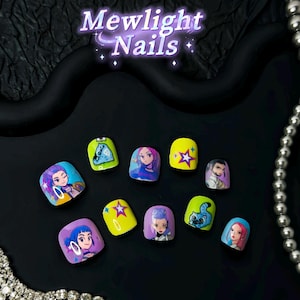 May include: A set of press-on nails with cartoon character designs. The nails are various colors, including yellow, blue, and purple, and feature images of anime-style characters. The text "Mewlight Nails" is displayed at the top.
