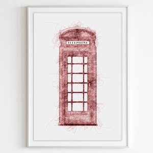 Puede incluir: Impresión artística enmarcada con un boceto de una cabina telefónica roja. La obra de arte tiene un estilo texturizado y garabateado, con la palabra "TELEPHONE" en la parte superior. La impresión está sobre un fondo blanco.