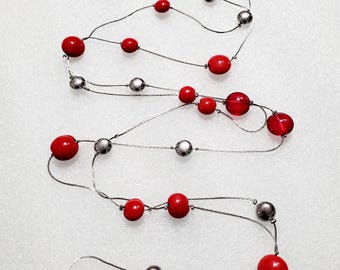 Long Red Faceted Acrylic and Glass Beads in Silvertone Chain