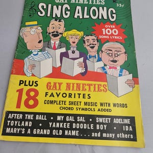 May include: Vintage "Gay Nineties Sing Along" magazine. The cover features cartoon illustrations of people singing, with text including "Over 100 Song Lyrics" and song titles like "After the Ball" and "My Gal Sal". The magazine is yellow, green, and red.