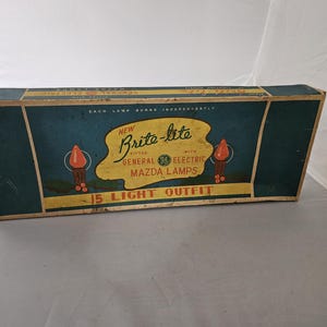 May include: A blue and yellow box for a 15 light string of Christmas lights. The box says "New Brite-lite" and is fitted with General Electric Mazda lamps.