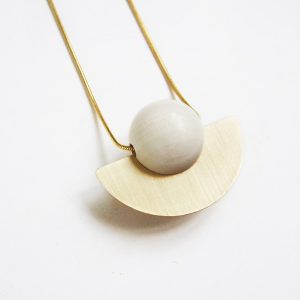 DISC - Ivory wooden bead and raw brass disc