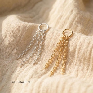 May include: Two G23 titanium jewellery components, one silver-toned and one gold-toned, each featuring a circular ring base with three dangling chain strands. The metal links are uniform in size and shape, creating a cascading effect for each piece.