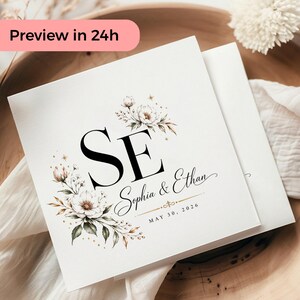 Könnte beinhalten: Quadratische weiße Hochzeitseinladung mit floralen Akzenten und den Initialen "SE". Die Namen "Sophia & Ethan" und das Datum "MAY 30, 2026" sind ebenfalls abgebildet. Der Text "Preview in 24h" befindet sich in einem rosa Rechteck.