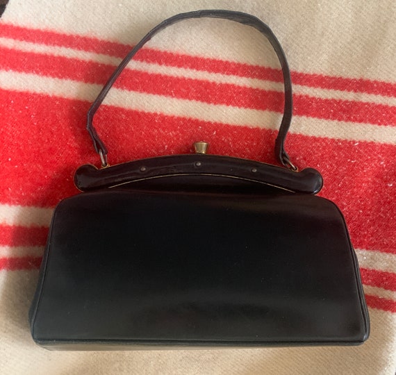 Vintage handbag | black leather | bag | top handle | sixties | gold hardware