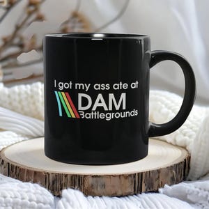 Scrappy Arc Raiders Gaming Mug, I Got My Ass Ate At Dam Battlegrounds Funny Retro Arcade Raiders Coffee Mug, Video Game Emote Gamer Gift