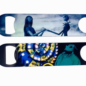May include: Two metal bottle openers featuring characters from The Nightmare Before Christmas. The top opener shows Sally and Jack Skellington, while the bottom one depicts Oogie Boogie. Both have a dark blue background.