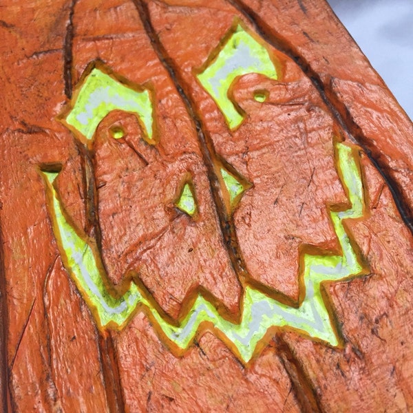 Jack O'Lantern Halloween prop occult spellbook, evil pumpkin face book built off of "J is for Judgement" by Sue Grafton