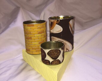 Upcycled cans desk organizer with coffee cups, chocolate, and gold bricks