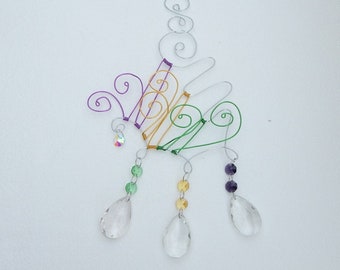 Suncatcher crystals with an abstract wire design hanger. Mardi Gras colors with vintage pendant drops.