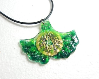Lucky coin and ginkgo leaf resin pendant.