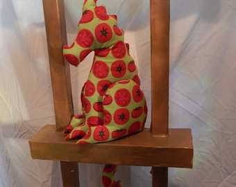 Niñera de estante de silueta de dragón de tomate, una decoración de estilo casa de campo.