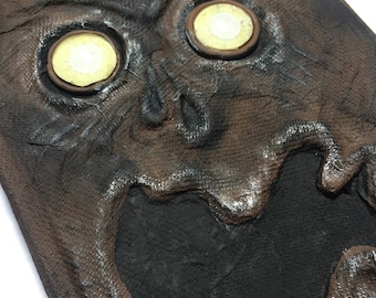 Evil Book with glow in the dark glass eyes, Halloween prop occult spellbook, "I is for Innocent" by Sue Grafton, Lovecraft Necronomicon