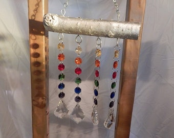 LGBTQA rainbow pride driftwood suncatcher.