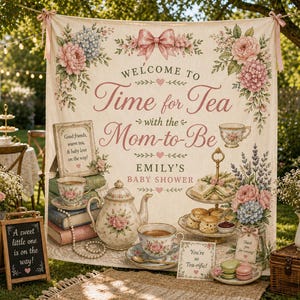 May include: A cream-coloured baby shower backdrop with floral and bow accents. The banner reads "Welcome to Time for Tea with the Mom-to-Be." A small chalkboard sign says "A sweet little one is on the way!" Teacups, a teapot, and treats are displayed.